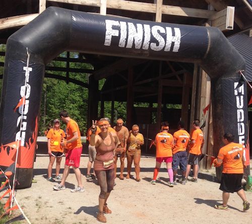 Iris Grimm crosses the finish line at the Tough Mudder